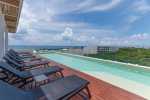 Community rooftop pool with ocean view